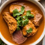 Bring the authentic flavors of South Africa to your next gathering with Durban Lamb Curry! Perfect for family dinners or festive occasions, this hearty dish pairs beautifully with rice, naan, or even poppadoms. Explore our guide to discover serving suggestions, side dishes, and tips for elevating your curry experience. Prepare to tantalize your guests' senses with a warm, fragrant, and deeply satisfying meal that they won’t soon forget!