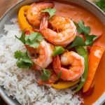 Experience a culinary adventure with Coconut Curry Shrimp with Rice, a delightful fusion of flavors that celebrates the best of tropical cuisine. From the first bite, you'll enjoy the harmonious blend of savory and sweet, with a hint of spice that will have you reaching for seconds and wanting to share this tropical delight with family and friends.