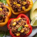 Prepare to impress with a dish that is as visually appealing as it is delicious. The striking colors of the stuffed peppers make for an inviting centerpiece, perfect for any gathering or a cozy family dinner.