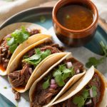 Treat yourself to a dish that embodies the soul of Mexican cuisine. The combination of juicy birria meat and a rich, aromatic consommé creates a dining experience that’s both satisfying and unforgettable, perfect for any occasion.