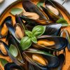 Experience the enticing aromas of fresh basil and zesty lime that elevate this dish to new heights. Let these Thai Red Curry Mussels take your taste buds on an unforgettable culinary journey.
